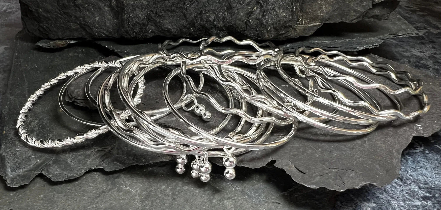 Multiple Bangles Displayed on Pieces of Slate - Kerry Gallop Jewellery