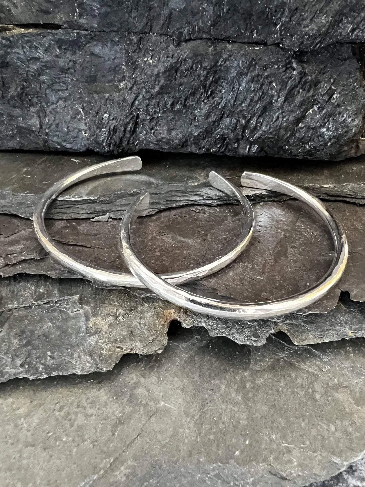 Two Torque Bangles Displayed on Slate - Kerry Gallop Jewellery