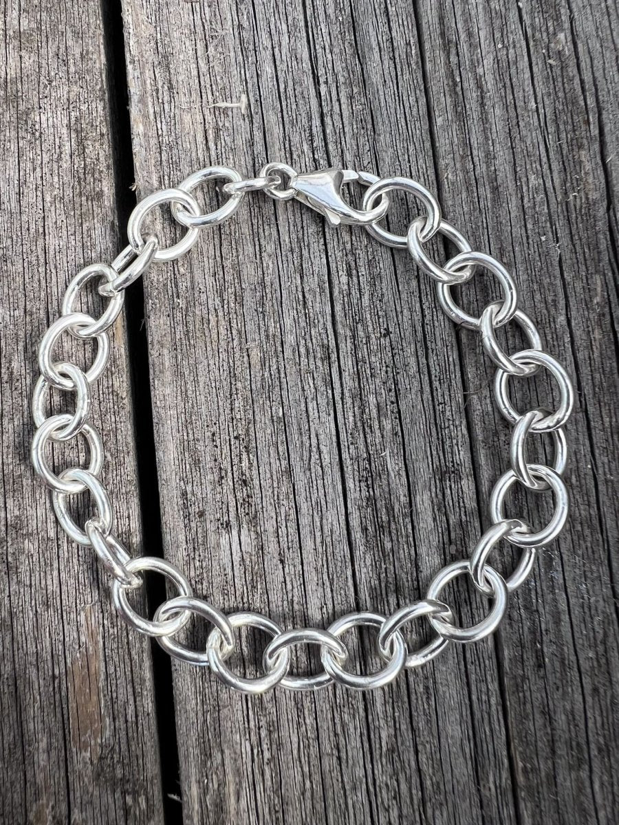 Recycled sterling silver Lina trace chain bracelet on weathered wood, handmade Isle of Wight jewellery