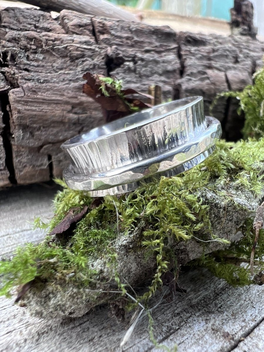 Sterling silver spinner ring with hammered outer band styled on mossy stone handmade anxiety ring Isle of Wight
