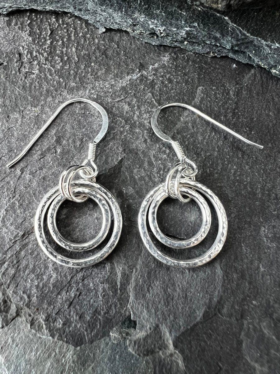 Sterling Silver Harmonic Circles Earrings Close Up on Slate Background - Kerry Gallop Jewellery