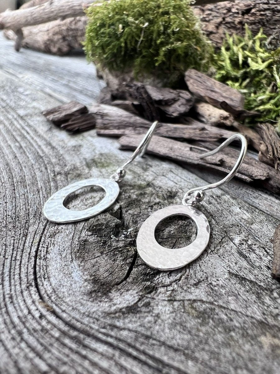 Recycled sterling silver textured oval earrings styled on mossy weathered wood, handmade Isle of Wight jewellery